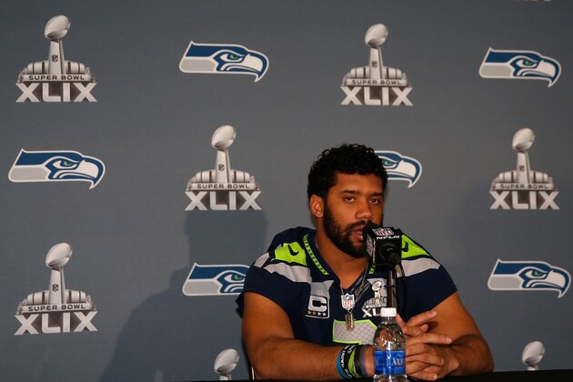 CHANDLER, AZ - JANUARY 29:  Quarterback Russell Wilson #3 of the Seattle Seahawks speaks during a Super Bowl XLIX media availability at the Arizona Grand Hotel on January 29, 2015 in Chandler, Arizona.  (Photo by Christian Petersen/Getty Images)