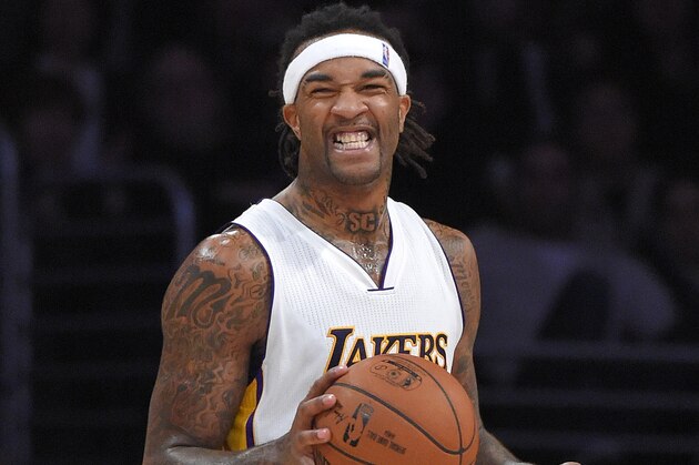 Los Angeles Lakers center Jordan Hill smiles during the second half of an NBA basketball game against the Portland Trail Blazers, Sunday, Jan. 11, 2015, in Los Angeles.  The Heat won 106-94. (AP Photo/Mark J. Terrill)