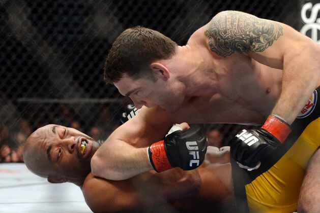 Dec 28, 2013; Las Vegas, NV, USA;    Chris Weidman (red gloves) and Anderson Silva (blue gloves) fight during their UFC middleweight championship bout at the MGM Grand Garden Arena. Weidman won. Mandatory Credit: Jayne Kamin-Oncea-USA TODAY Sports