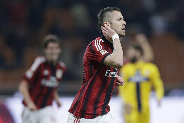 AC Milan's Jeremy Menez celebrates after scoring during a Serie A soccer match between AC Milan and Parma, at the San Siro stadium in Milan, Italy, Sunday, Feb.1, 2015. (AP Photo/Luca Bruno)