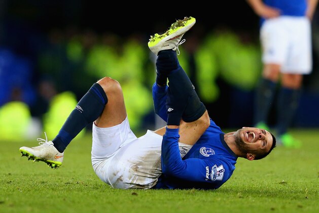 LIVERPOOL, ENGLAND - DECEMBER 15: Kevin Mirallas of Everton lies injured after a challenge by Jordan Mutch of QPR during the Barclays Premier League match between Everton and Queens Park Rangers at Goodison Park on December 15, 2014 in Liverpool, England.  (Photo by Alex Livesey/Getty Images)