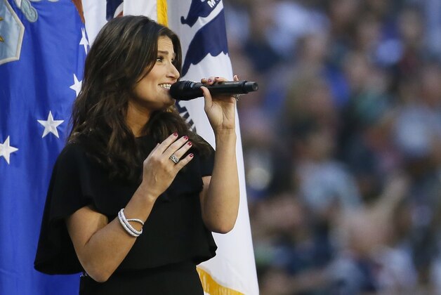 Idina Menzel sings the national anthem before the NFL Super Bowl XLIX football game between the Seattle Seahawks and the New England Patriots Sunday, Feb. 1, 2015, in Glendale, Ariz.  (AP Photo/Matt York)