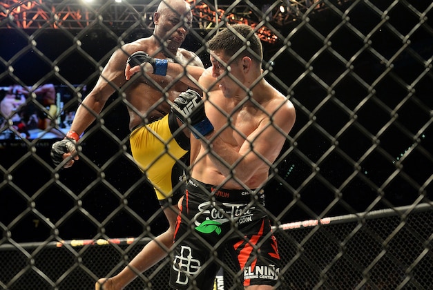 Jan 31, 2015; Las Vegas, NV, USA; Anderson Silva (red gloves) knees Nick Diaz (blue gloves) during their middleweight bout during UFC 183 at the MGM Grand Garden Arena. Mandatory Credit: Jayne Kamin-Oncea-USA TODAY Sports