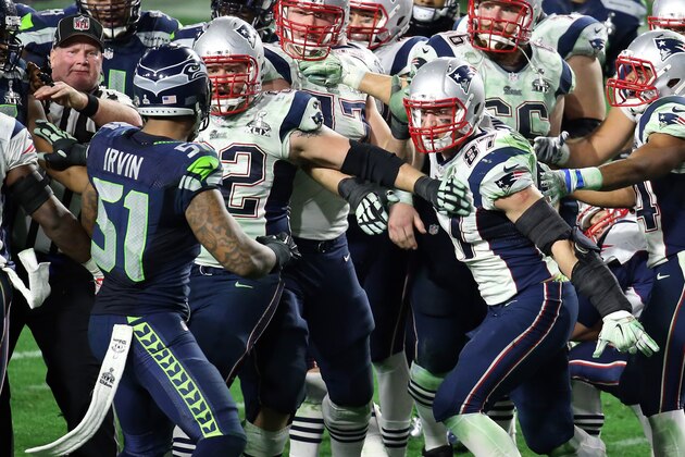 GLENDALE, AZ - FEBRUARY 01:  Bruce Irvin #51 of the Seattle Seahawks and  Rob Gronkowski #87 of the New England Patriots exchange words late in the fourth quarter during Super Bowl XLIX at University of Phoenix Stadium on February 1, 2015 in Glendale, Arizona.  (Photo by Andy Lyons/Getty Images)