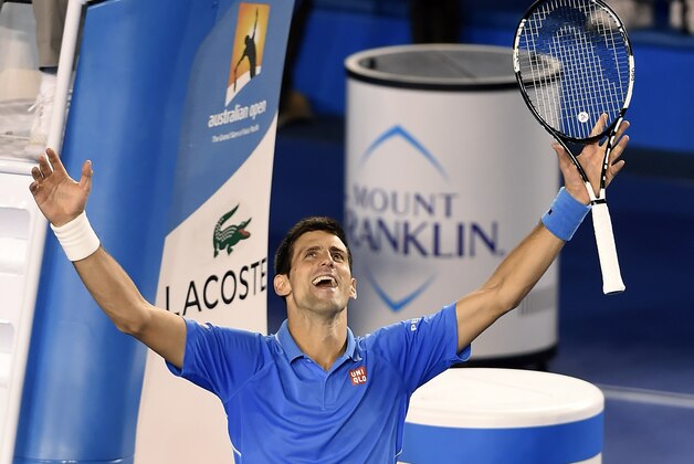 Novak Djokovic of Serbia celebrates after defeating Andy Murray of Britain in the men's singles final at the Australian Open tennis championship in Melbourne, Australia, Sunday, Feb. 1, 2015. (AP Photo/Andy Brownbill)