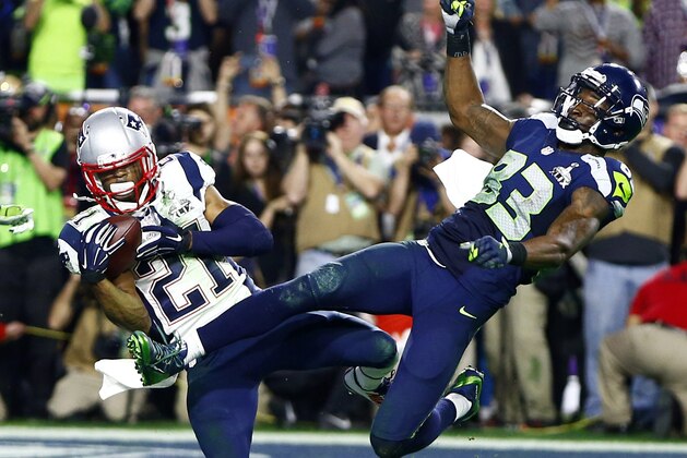 Feb 1, 2015; Glendale, AZ, USA; New England Patriots strong safety Malcolm Butler (21) intercepts a pass intended for Seattle Seahawks wide receiver Ricardo Lockette (83) in the fourth quarter in Super Bowl XLIX at University of Phoenix Stadium. Mandatory Credit: Mark J. Rebilas-USA TODAY Sports