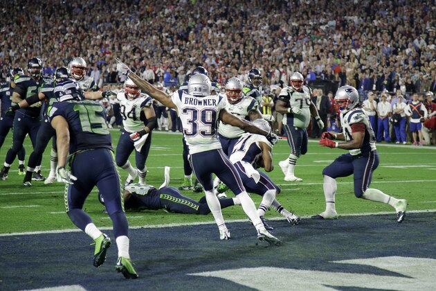 New England Patriots' Brandon Browner (39) celebrates as strong safety Malcolm Butler (21) intercepts a pass from Seattle Seahawks quarterback Russell Wilson during the second half of NFL Super Bowl XLIX football game Sunday, Feb. 1, 2015, in Glendale, Ariz. (AP Photo/Matt Rourke)
