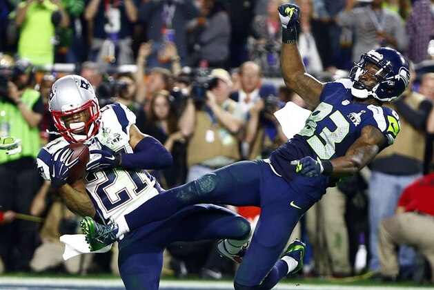 Feb 1, 2015; Glendale, AZ, USA; New England Patriots strong safety Malcolm Butler (21) intercepts a pass intended for Seattle Seahawks wide receiver Ricardo Lockette (83) in the fourth quarter in Super Bowl XLIX at University of Phoenix Stadium. Mandatory Credit: Mark J. Rebilas-USA TODAY Sports