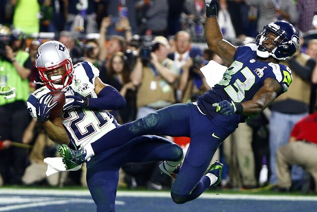 Feb 1, 2015; Glendale, AZ, USA; New England Patriots strong safety Malcolm Butler (21) intercepts a pass intended for Seattle Seahawks wide receiver Ricardo Lockette (83) in the fourth quarter in Super Bowl XLIX at University of Phoenix Stadium. Mandatory Credit: Mark J. Rebilas-USA TODAY Sports