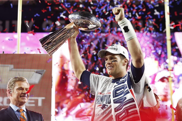 GLENDALE, AZ - FEBRUARY 01:  Tom Brady #12 of the New England Patriots celebrates with the Vince Lombardi Trophy after defeating the Seattle Seahawks 28-24 to win Super Bowl XLIX at University of Phoenix Stadium on February 1, 2015 in Glendale, Arizona.  (Photo by Christian Petersen/Getty Images)