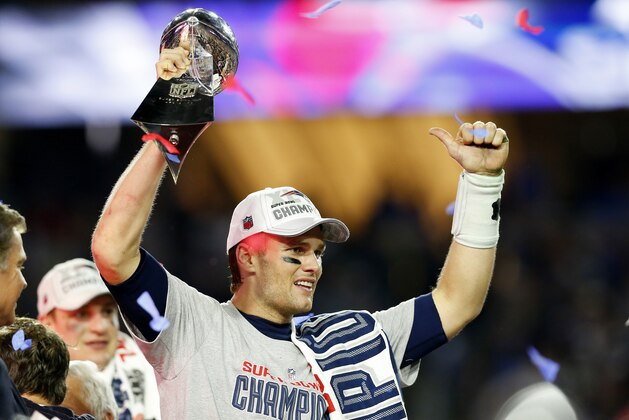 GLENDALE, AZ - FEBRUARY 01: Tom Brady #12 of the New England Patriots celebrates with the Vince Lombardi Trophy after defeating the Seattle Seahawks 28-24 to win Super Bowl XLIX at University of Phoenix Stadium on February 1, 2015 in Glendale, Arizona.  (Photo by Tom Pennington/Getty Images)