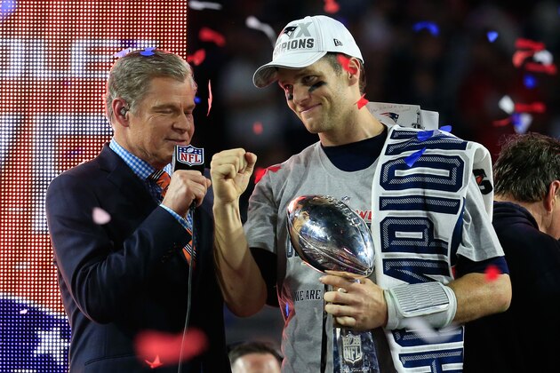 GLENDALE, AZ - FEBRUARY 01:  Tom Brady #12 of the New England Patriots celebrates holding the Vince Lombardi Trophy after defeating the Seattle Seahawks as TV personality Dan Patrick looks on during Super Bowl XLIX at University of Phoenix Stadium on February 1, 2015 in Glendale, Arizona. The Patriots defeated the Seahawks 28-24.  (Photo by Rob Carr/Getty Images)