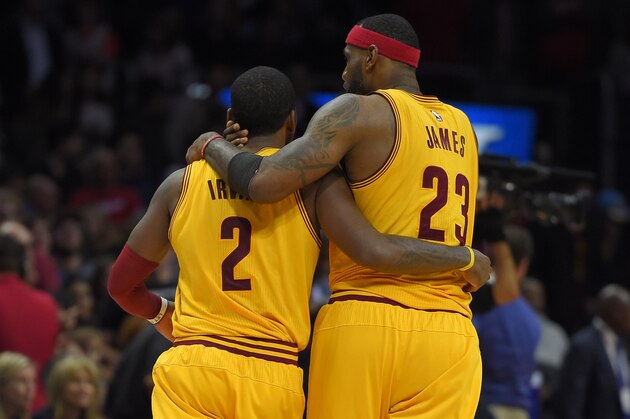 Cleveland Cavaliers guard Kyrie Irving, left, and forward LeBron James hug during the second half of an NBA basketball game against the Los Angeles Clippers, Friday, Jan. 16, 2015, in Los Angeles. The Cavaliers won 126-121. (AP Photo/Mark J. Terrill)