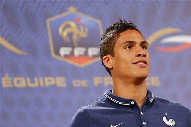 CORRECTS DATE - France's defender Raphael Varane answers journalists' questions during a press conference at the Teatro Pedro II, in Ribeirao Preto, Brazil, Wednesday, June 21, 2014. Having captured people's attention at the soccer World Cup with some scintillating attacking football, France's players are now in unknown territory after raising expectations back home, having routed Switzerland and Honduras. (AP Photo/David Vincent)