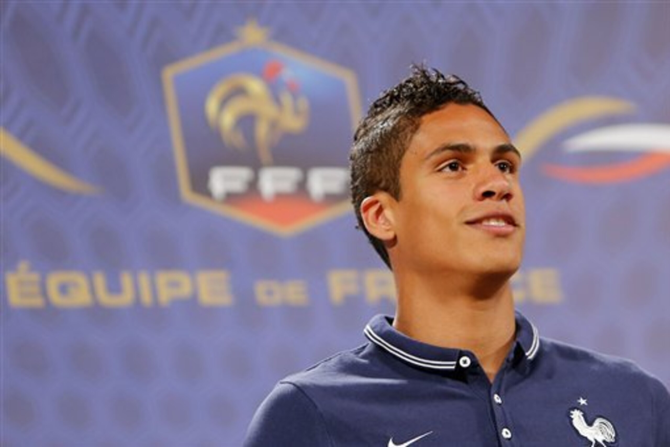 CORRECTS DATE - France's defender Raphael Varane answers journalists' questions during a press conference at the Teatro Pedro II, in Ribeirao Preto, Brazil, Wednesday, June 21, 2014. Having captured people's attention at the soccer World Cup with some scintillating attacking football, France's players are now in unknown territory after raising expectations back home, having routed Switzerland and Honduras. (AP Photo/David Vincent)