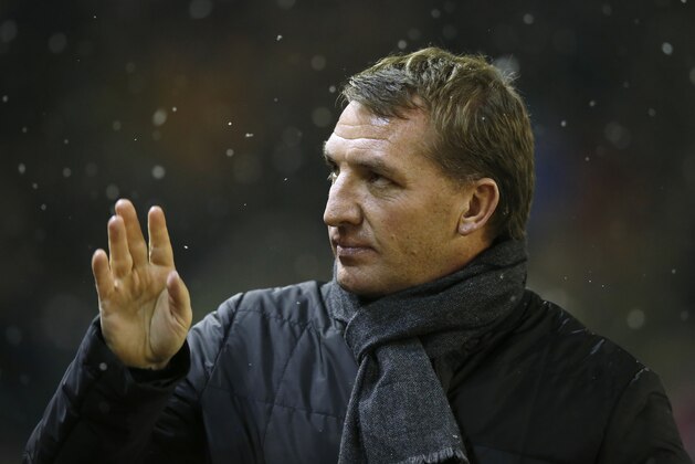 Liverpool's manager Brendan Rodgers waves as he takes to the touchline before his team's Chelsea's during the English League Cup semi-final first leg soccer match between Liverpool and Chelsea at Anfield Stadium, Liverpool, England, Tuesday Jan. 20, 2015. (AP Photo/Jon Super)