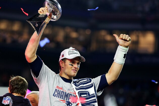 GLENDALE, AZ - FEBRUARY 01:  Tom Brady #12 of the New England Patriots celebrates with the Vince Lombardi Trophy after defeating the Seattle Seahawks 28-24 to win Super Bowl XLIX at University of Phoenix Stadium on February 1, 2015 in Glendale, Arizona.  (Photo by Elsa/Getty Images)