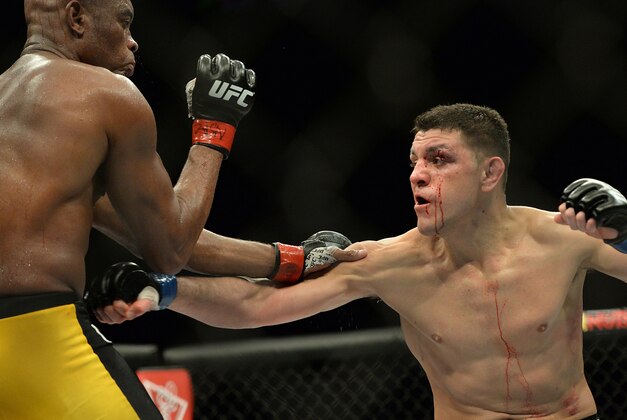 Jan 31, 2015; Las Vegas, NV, USA; Anderson Silva (red gloves) and Nick Diaz (blue gloves) fight during their middleweight bout during UFC 183 at the MGM Grand Garden Arena. Mandatory Credit: Jayne Kamin-Oncea-USA TODAY Sports