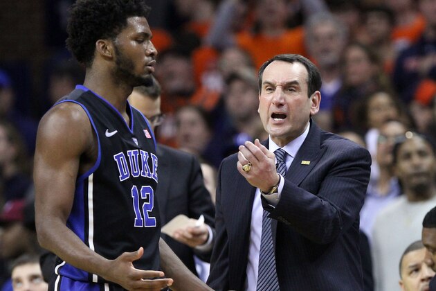 Duke coach Mike Krzyzewski calls out to his players alongside forward Justise Winslow (12) during the second half of an NCAA college basketball game against Virginia in Charlottesville, Va., on Saturday, Jan. 31, 2015. Duke won 69-63. (AP Photo/Ryan M. Kelly)