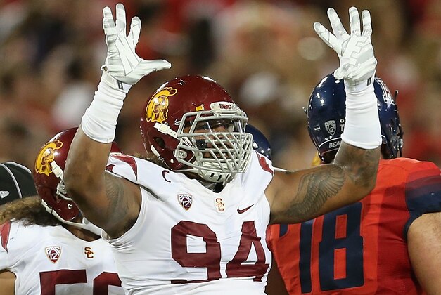 TUCSON, AZ - OCTOBER 11:  Defensive end Leonard Williams #94 of the USC Trojans reacts after a sack during the college football game against the Arizona Wildcats at Arizona Stadium on October 11, 2014 in Tucson, Arizona.  The Trojans defeatred the Wildcats 28-26.  (Photo by Christian Petersen/Getty Images)