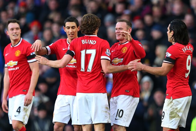 MANCHESTER, ENGLAND - JANUARY 31:  Daley Blind #17 of Manchester United and Wayne Rooney of Manchester United celebrate after their interplay led to their team's third goal during the Barclays Premier League match between Manchester United and Leicester City at Old Trafford on January 31, 2015 in Manchester, England.  (Photo by Alex Livesey/Getty Images)