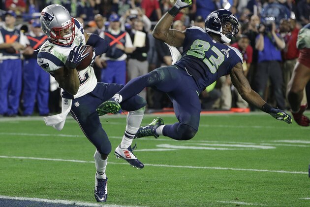 New England Patriots strong safety Malcolm Butler (21) intercepts a pass intended for Seattle Seahawks wide receiver Ricardo Lockette (83) during the second half of NFL Super Bowl XLIX football game Sunday, Feb. 1, 2015, in Glendale, Ariz. (AP Photo/Kathy Willens)