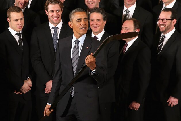 WASHINGTON, DC - FEBRUARY 02:  U.S. President Barack Obama takes a closer look at the silver hockey stick he was given by the National Hockey League champions Los Angeles Kings in the East Room of the White House February 2, 2015 in Washington, DC. Obama simultaneously hosted the Major League Soccer champions Los Angeles Galaxy. Both teams are owned in part by billionaire and The Weekly Standard publisher Philip Anschutz.  (Photo by Chip Somodevilla/Getty Images)