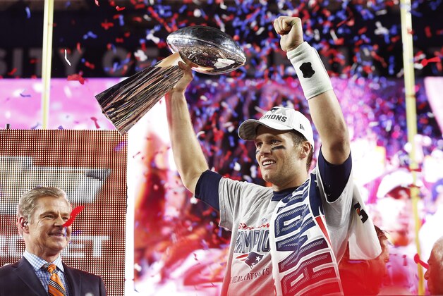 GLENDALE, AZ - FEBRUARY 01:  Tom Brady #12 of the New England Patriots celebrates with the Vince Lombardi Trophy after defeating the Seattle Seahawks 28-24 to win Super Bowl XLIX at University of Phoenix Stadium on February 1, 2015 in Glendale, Arizona.  (Photo by Christian Petersen/Getty Images)