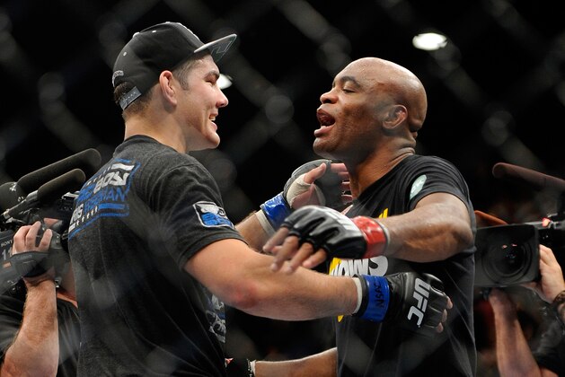 Chris Weidman, left, and Anderson Silva embrace after their UFC 162 mixed martial arts middleweight championship bout at the MGM Grand Garden Arena on Saturday, July 6, 2013, in Las Vegas.  Weidman won the fight with a TKO. (AP Photo/David Becker)