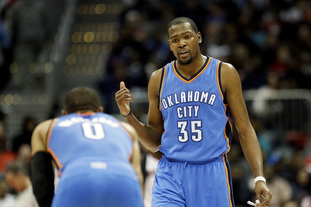 Oklahoma City Thunder's Kevin Durant, right, talks to teammate Russell Westbrook during the second quarter of an NBA basketball game against the Atlanta Hawks, Friday, Jan. 23, 2015, in Atlanta. The Hawks won 103-93. (AP Photo/David Goldman)