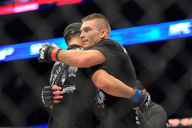 Jan 18, 2015; Boston, MA, USA; Johnny Case (red) and Frankie Perez (blue) hug after a lightweight bout at UFC Fight Night at TD Garden. Mandatory Credit: Bob DeChiara-USA TODAY Sports Jan 18, 2015; Boston, MA, USA; Johnny Case (red) and Frankie Perez (blue) hug after a lightweight bout at UFC Fight Night at TD Garden. Mandatory Credit: Bob DeChiara-USA TODAY Sports
