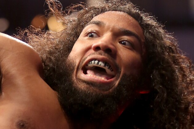 Benson Henderson is seen climbing on the Octagon cage after his lightweight fight against Donald Cerrone at UFC Fight Night Boston, Sunday, January 18, 2015 in Boston.  Cerrone won via unanimous decision. (AP Photo/Gregory Payan)