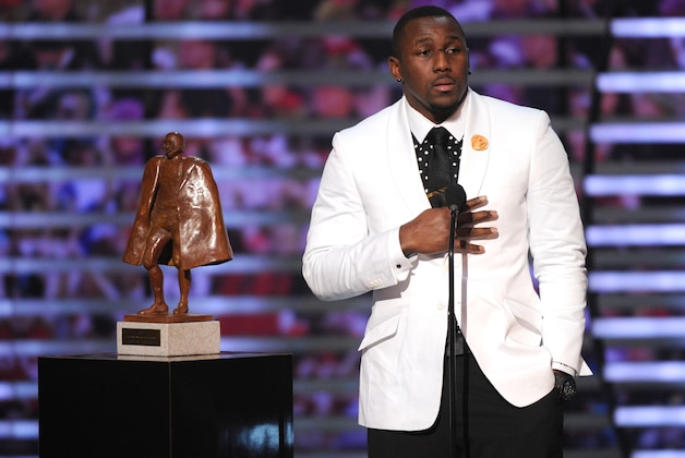 Thomas Davis, of the Carolina Panthers, accepts the Walter Payton  NFL man of the year award, presented by Nationwide, on stage at the 4th annual NFL Honors at the Phoenix Convention Center Symphony Hall on Saturday, Jan. 1, 2015. (Photo by Frank Micelotta/Invision for NFL/AP Images)