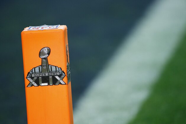 The Super Bowl Logo is seen on an end zone marker during the second half of NFL Super Bowl XLIX football game between the Seattle Seahawks and the New England Patriots Sunday, Feb. 1, 2015, in Glendale, Ariz. (AP Photo/Matt York)