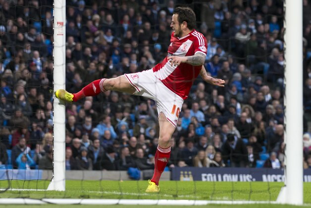 Middlesbrough's Lee Tomlin lashes out after narrowly failing to score after a rebound off the post during the English FA Cup fourth round soccer match between Manchester City and Middlesbrough at the Etihad Stadium, Manchester, England, Saturday, Jan. 24, 2015. (AP Photo/Jon Super)