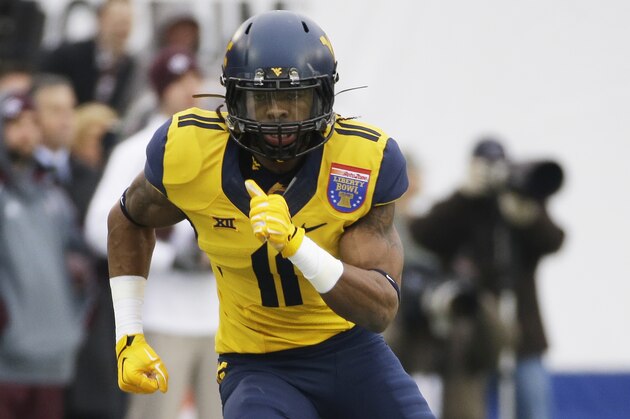 West Virginia wide receiver Kevin White plays against Texas A&M in the first half of the Liberty Bowl NCAA college football game Monday, Dec. 29, 2014, in Memphis, Tenn. (AP Photo/Mark Humphrey)