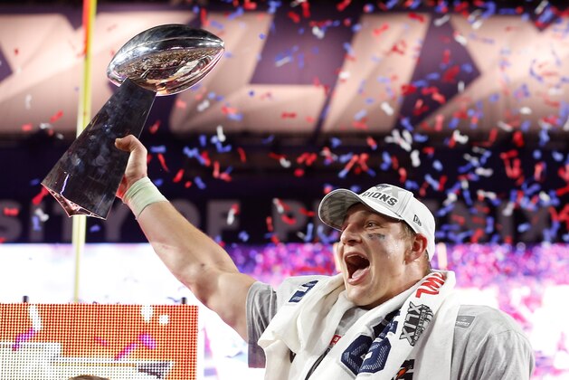 GLENDALE, AZ - FEBRUARY 01:  Rob Gronkowski #87 of the New England Patriots celebrates with the Vince Lombardi Trophy at the trophy ceremony after defeating the Seattle Seahawks 28-24 to win Super Bowl XLIX at University of Phoenix Stadium on February 1, 2015 in Glendale, Arizona.  (Photo by Christian Petersen/Getty Images)