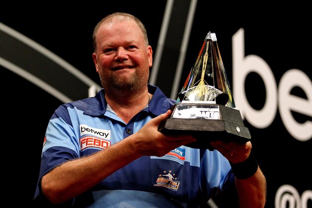 LONDON, ENGLAND - MAY 22:  Raymond van Barneveld of the Netherlands celebrates with the trophy after winning the McCoys Premier League Darts Play-Offs Semi Final match between Michael van Gerwen and Gary Anderson at O2 Arena on May 22, 2014 in London, England.  (Photo by Ben Hoskins/Getty Images)