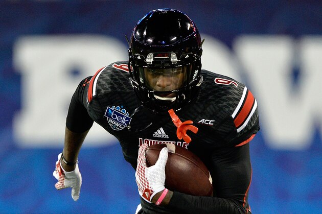 CHARLOTTE, NC - DECEMBER 30:  DeVante Parker #9 of the Louisville Cardinals warms up before the Belk Bowl against the Georgia Bulldogs at Bank of America Stadium on December 30, 2014 in Charlotte, North Carolina.  (Photo by Grant Halverson/Getty Images)