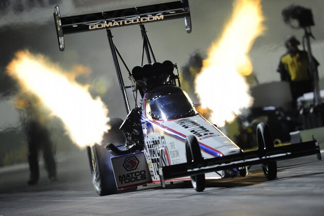 In this photo provided by NHRA, Antron Brown drives during Top Fuel qualifying Friday, Feb. 7, 2014, at the NHRA Winternationals in Pomona, Calif. He topped the field with a run of  3.731 seconds at 326.00 mph. (AP Photo/NHRA, Marc Gewertz)