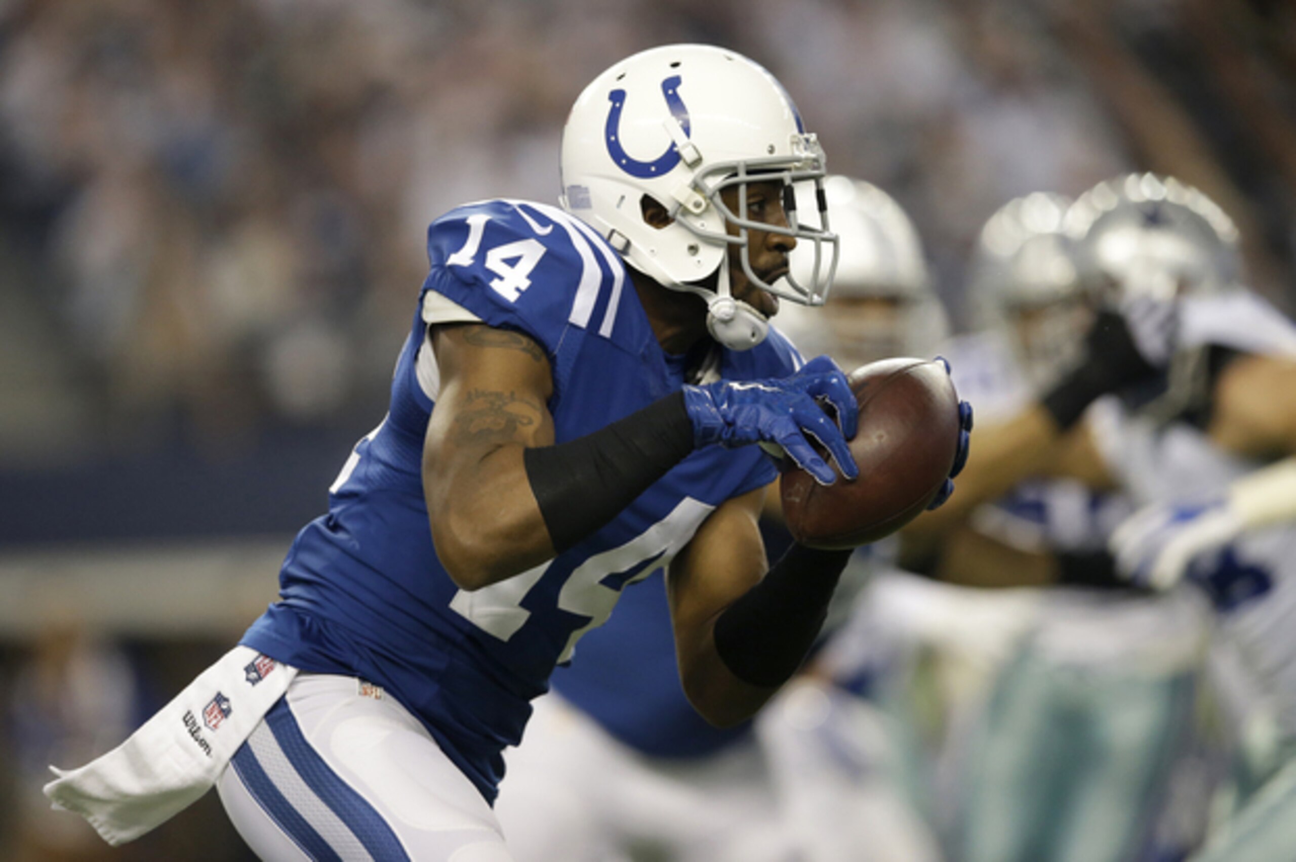Indianapolis Colts wide receiver Hakeem Nicks (14) grabs a pass during the first half of an NFL football game against the Dallas Cowboys, Sunday, Dec. 21, 2014, in Arlington, Texas. (AP Photo/Tim Sharp)