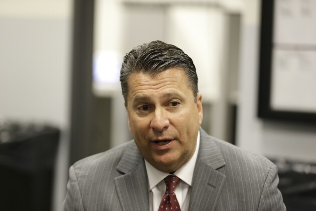 Fordham head coach for men's basketball Tom Pecora talks to reporters during the Atlantic 10 media day in New York, Tuesday, Oct. 14, 2014. (AP Photo/Seth Wenig)