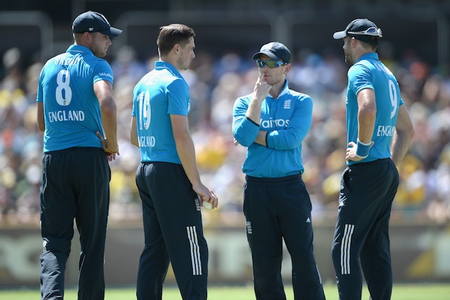 PERTH, AUSTRALIA - FEBRUARY 01:  England captain Eoin Morgan speaks with his bowlers Stuart Broad, Chris Woakes and James Anderson during the final match of the Carlton Mid One Day International series between Australia and England at WACA on February 1, 2015 in Perth, Australia.  (Photo by Gareth Copley/Getty Images)