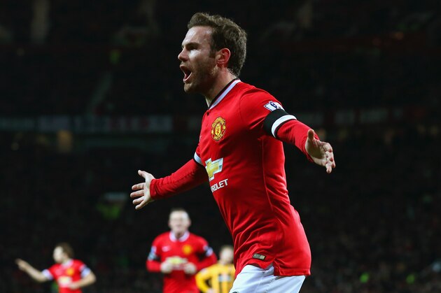MANCHESTER, ENGLAND - FEBRUARY 03:  Juan Mata of Manchester United celebrates scoring the opening goal during the FA Cup Fourth round replay match between Manchester United and Cambridge United at Old Trafford on February 3, 2015 in Manchester, England.  (Photo by Alex Livesey/Getty Images)