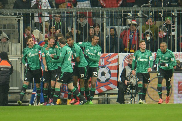 Schalke's players celebrate after scoring during the  soccer match between FC Bayern Munich and FC Schalke in the Allianz Arena in Munich, Germany, on Tuesday, Feb. 3, 2015. (AP Photo/Kerstin Joensson)