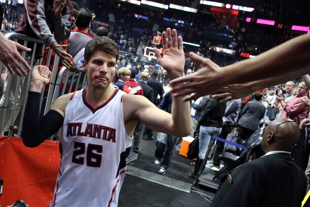 Jan 28, 2015; Atlanta, GA, USA; Atlanta Hawks guard Kyle Korver (26) celebrates with fans after their win over the Brooklyn Nets at Philips Arena. The Hawks won 113-102. Mandatory Credit: Jason Getz-USA TODAY Sports