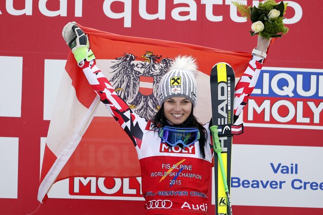 Austria's Anna Fenninger celebrates on the podium after winning the women's super-G competition at the alpine skiing world championships on Tuesday, Feb. 3, 2015, in Beaver Creek, Colo. (AP Photo/Marco Trovati)