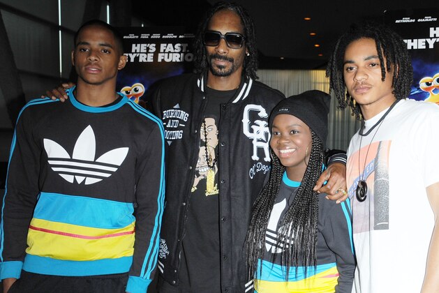 Snoop Dogg, second from left, and his children, Corde Broadus, Cori Broadus, and Cordell Broadus attend the Snoop Dogg and The Snoop Youth Football League's special screening of