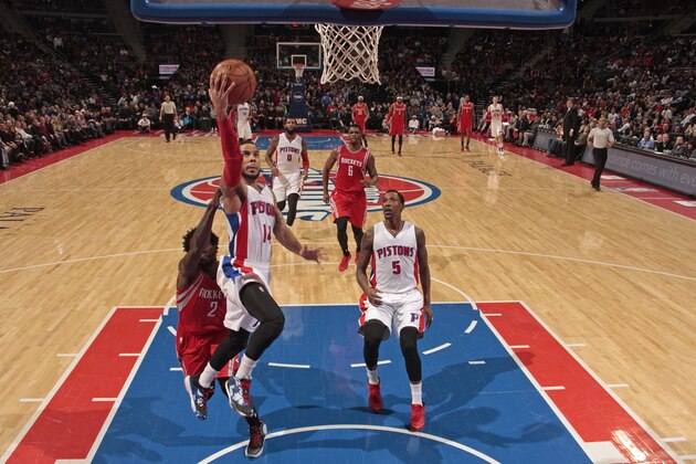 AUBURN HILLS, MI - JANUARY 31:  D.J. Augustin #14 of the Detroit Pistons drives to the basket against the Houston Rockets on January 31, 2015 at The Palace of Auburn Hills in Auburn Hills, Michigan. NOTE TO USER: User expressly acknowledges and agrees that, by downloading and/or using this photograph, User is consenting to the terms and conditions of the Getty Images License Agreement.  Mandatory Copyright Notice: Copyright 2015 NBAE (Photo by B. Sevald/Einstein/NBAE via Getty Images)
