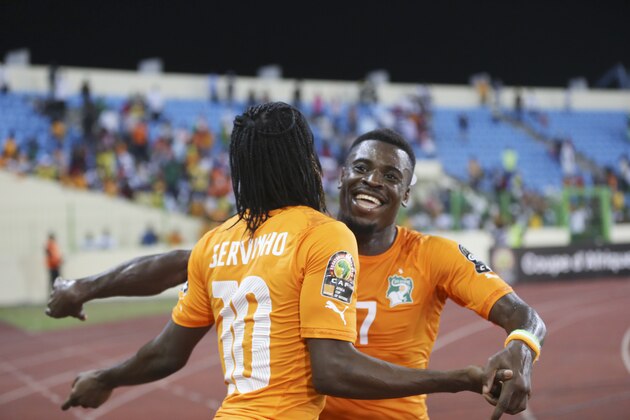 Ivory Coast’s Gervinho, left, and Serge Aurier, right, celebrates during their African Cup of Nations quarter final soccer match with Algeria at the Estadio De Malabo, Equatorial Guinea, Sunday, Feb. 1, 2015. (AP Photo/Sunday Alamba)